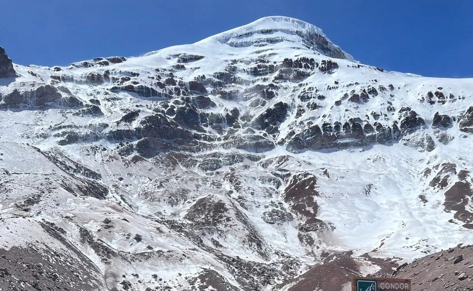 The snow-covered Andes beneath a clear sky, from our family’s photographs